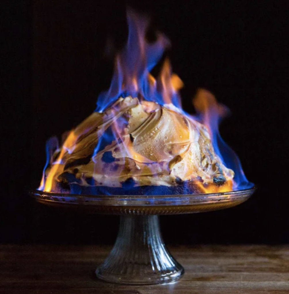Baked Alaska Cake in blue flames